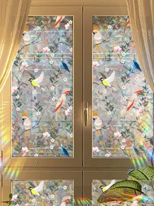 Decorative static window film with colorful bird and prism rainbow suncatcher effect for glass.