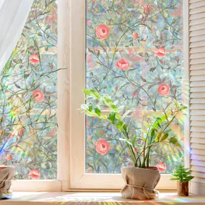Detailed view of colorful rainbow window film with rose vine pattern and prism sun catcher effect.