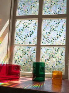 Detailed view of colorful sun catcher window sticker, holographic prism rainbow glass film.