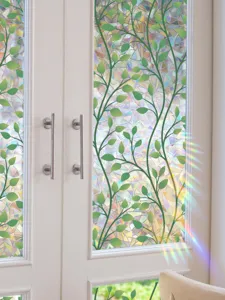 Colorful decorative glass window film with green vine and rainbow prism effect for home decor.