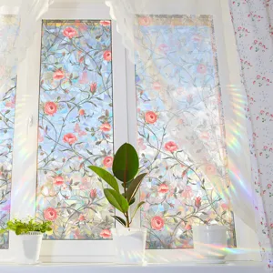 Detailed view of colorful rainbow window film suncatcher showing rose vine prism effect on glass.