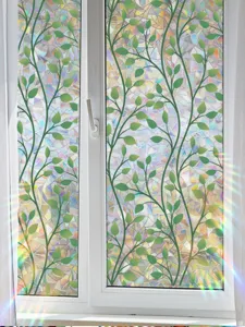 Prismatic window film, green vine leaf pattern, decorative glass sticker with rainbow light.