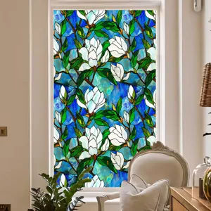 Decorative stained glass window film with floral magnolia pattern for privacy and home decor.
