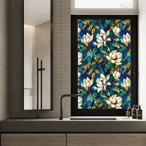 Detailed view of the colorful floral stained glass window film installed on a bathroom window.