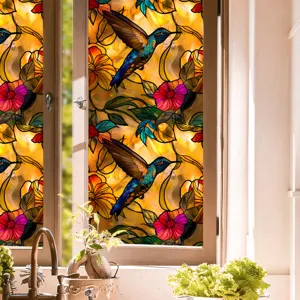 Colorful stained glass window film with hummingbird floral design for privacy and UV protection.