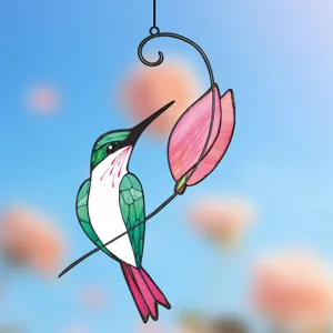 Detailed close-up of the hummingbird window hanging ornament, fine metal iron art craftsmanship.