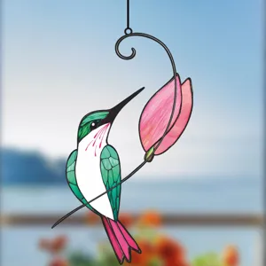 Detailed view of the stained glass hummingbird hanging ornament with a pink flower design.