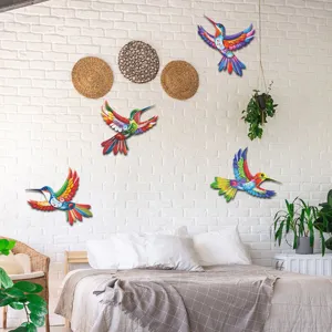 Colorful metal hummingbird wall art hanging in bedroom scene, vibrant decoration for home walls.