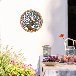 Circular wooden frame metal wall art hanging with tree and birds design for home decoration.