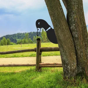 Detail view of the black metal duck tree plug-in garden art decoration, durable outdoor yard decor.