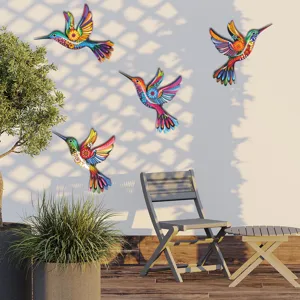Metal hummingbird wall art detail, colorful hanging decor for outdoor garden fence.