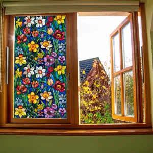 Stained glass window film detail showing colorful floral pattern applied on glass.