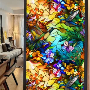 Stained glass window film detail showcasing vibrant hummingbird and colorful floral patterns for home.