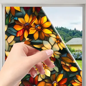 Close-up detail of stained glass window film, colorful sunflower floral pattern, translucent.