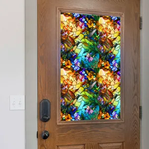 Decorative stained glass window film with hummingbird and flower pattern for privacy.