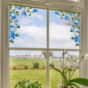 Static cling window film with blue floral stained glass design for privacy and home decor.