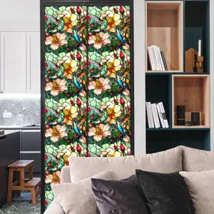 Decorative stained glass window film with hummingbird and flower pattern for home privacy.