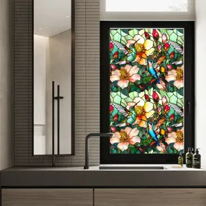 Decorative stained glass window film featuring hummingbird and floral patterns for privacy.
