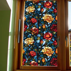 Stained glass window film with vibrant red and yellow roses design for home privacy decor.