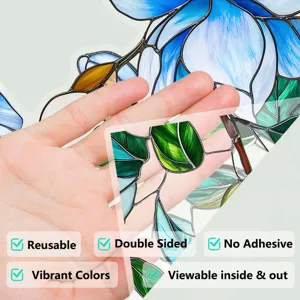 Stained glass window film detail showing vibrant blue floral pattern and translucent dual-side texture.