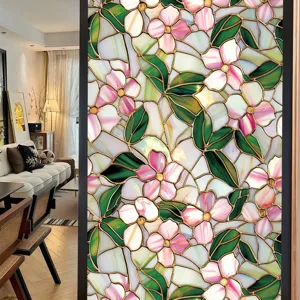 Decorative stained glass window film with pink floral pattern for home decor detail.