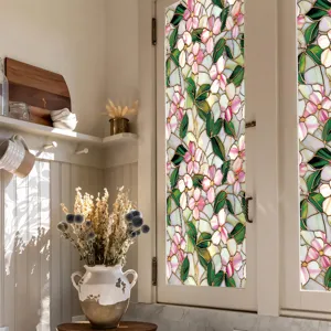 Stained glass window film detail showing pink floral pattern on kitchen glass door.