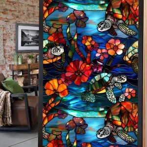 Stained glass window film detail featuring sea turtle and colorful flower patterns