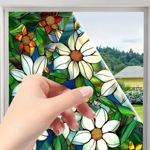 Stained glass window film detail showing floral pattern peeling easily from glass pane.