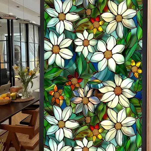 Stained glass window film detail showing vintage white daisy floral pattern for home decor.