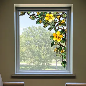 Detailed view of stained glass window film featuring a floral green plant design, decor.