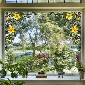 Detailed view of decorative stained glass window film featuring a floral corner pattern design.