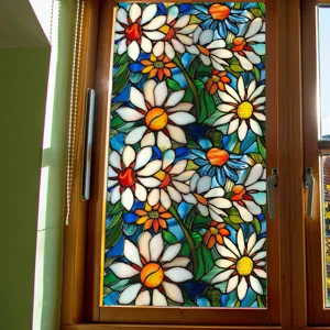 Stained glass window film detail showing vibrant floral daisy pattern on clear glass pane.