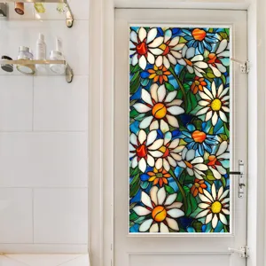 Stained glass window film detail showing colorful floral pattern applied on glass door.