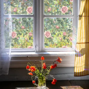 Stained glass window film with rose flower pattern, detail view of sun catcher sticker.