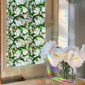 Decorative stained glass window film with elegant white magnolia flower design for privacy and light.
