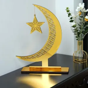 Gold acrylic moon and star tabletop decoration, elegant festive detail design for home room.