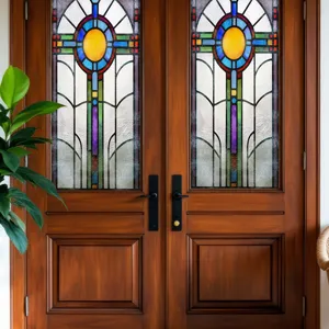 Colorful stained glass window film detail showcasing geometric patterns on doors.
