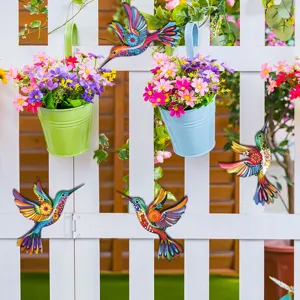 Colorful metal hummingbird wall art, vibrant hanging decor for garden fence, patio and outdoor spaces.