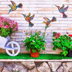 Metal hummingbird wall art, colorful hanging outdoor garden decor, set of 4 sculptures.