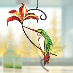 Stained glass style hummingbird and flower hanging ornament detail view showing vibrant colors.