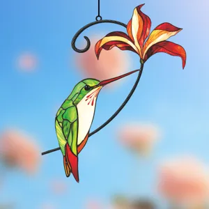 Stained glass style hummingbird and red flower hanging detail for window and wall decoration.