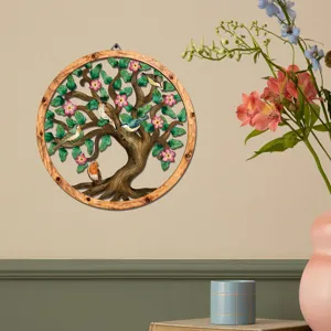 Detailed scene of circular wooden metal wall art hanging with tree and birds decor.