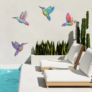 Colorful metal hummingbird wall art set for outdoor garden fence and home patio decoration.