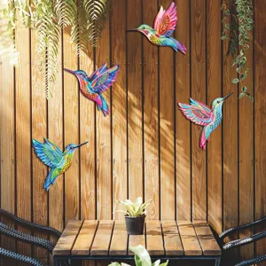 Metal hummingbird wall art detail, colorful hanging decor for outdoor garden fence and patio.