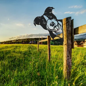 Outdoor metal dog fence insert for garden decoration, black iron animal silhouette decor.