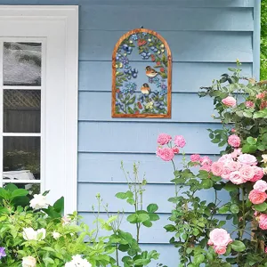 Details of the arched wooden and iron wall hanging featuring beautiful floral and bird decor.