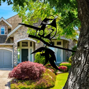 Metal garden bird silhouette tree art decor, outdoor yard branch ornament display detail.