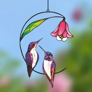Detailed view of the double-sided hummingbird stained glass style hanging window decor.