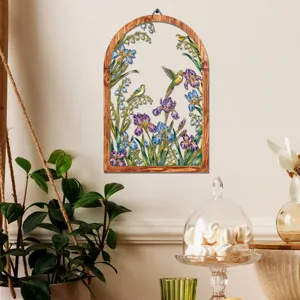 Wooden arched metal wall art hanging with floral and bird design, perfect for home decor detail.
