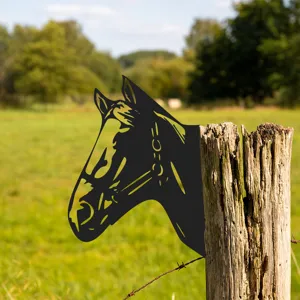 Detail shot of a black metal horse head garden insert, showcasing outdoor decoration effect.